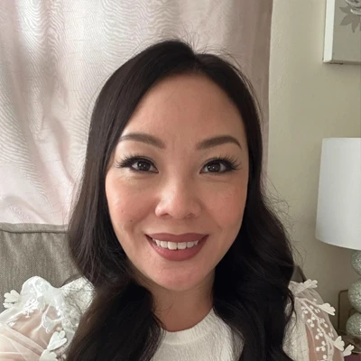 Massage therapist, Chelsea, smiling at camera.